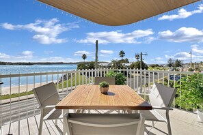 Outdoor dining - Modern 1-Bedroom Apt with Sweeping Water Views (Batemans Bay)