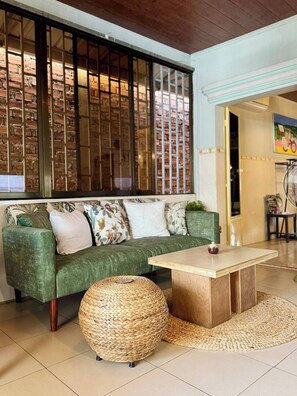 Apartment, 1 Bedroom, Smoking, Balcony | Living room | Books - Cozy 1990s Khmer Style Flat in Heart of Tonle Bassac (Phnom Penh)