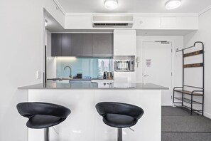 Fridge, microwave, oven, stovetop - Chic 1 Bed Inner-City Retreat with Pool and Views (Fortitude Valley)
