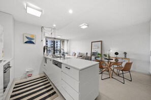 Fridge, microwave, oven, stovetop - Elegant 2-Bed with Pool, Alfresco Dining & Balcony (Lyons)