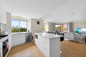Fridge, microwave, oven, stovetop - Stylish 2-Bed Camperdown Apartment with Balcony (Camperdown)