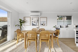 Dining - Chic Coastal 1-Bedroom Home with Balcony & BBQ (Dee Why)