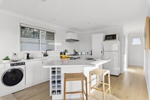 Fridge, microwave, oven, stovetop - Chic Coastal 1-Bedroom Home with Balcony & BBQ (Dee Why)