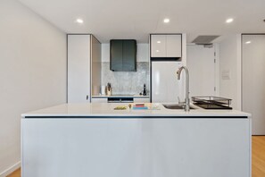Fridge, microwave, oven, stovetop - Sleek 1-Bed Canberra Flat with Gym & Sauna Access (City)