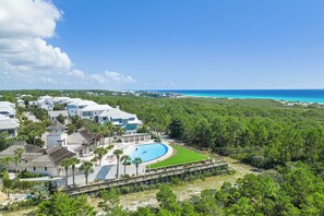 A large resort with multiple buildings, a swimming pool, and a view of the ocean. - 30A Retreat Near Gulf Place w/ Pool Access, Porch, Chef’s Kitchen & Bike Rental (Santa Rosa Beach)