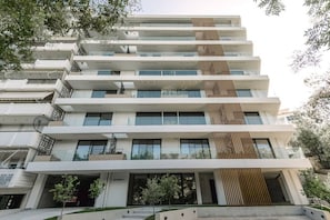 A multi-story building with balconies, large windows, and a modern architectural design. - Kalypso, Urban APT w/ Unique Views of Acropolis! (Athina)