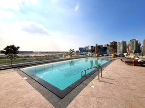 Pool - Sky-High 2BR w/ City Views, Minutes Drive to Downtown, Steps from the Bus Stop (Dubai)