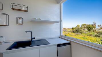 Fridge, electric kettle, cookware/dishes/utensils