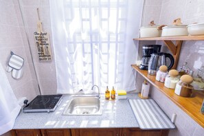 Standard Studio, Balcony | Private kitchen | Full-size fridge, microwave, electric kettle, cookware/dishes/utensils - Tadre House's (Arusha)