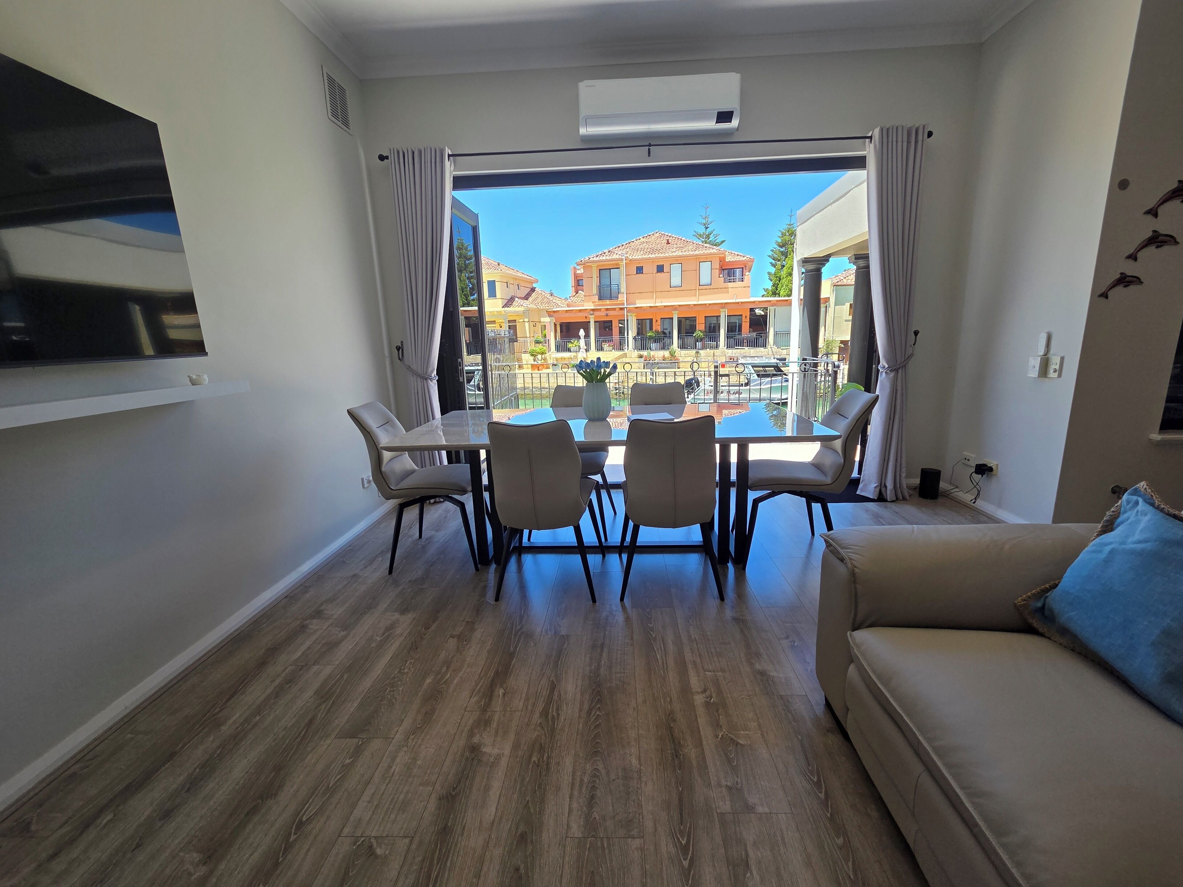 Large bi-fold doors blur the lines between indoors and outdoors.