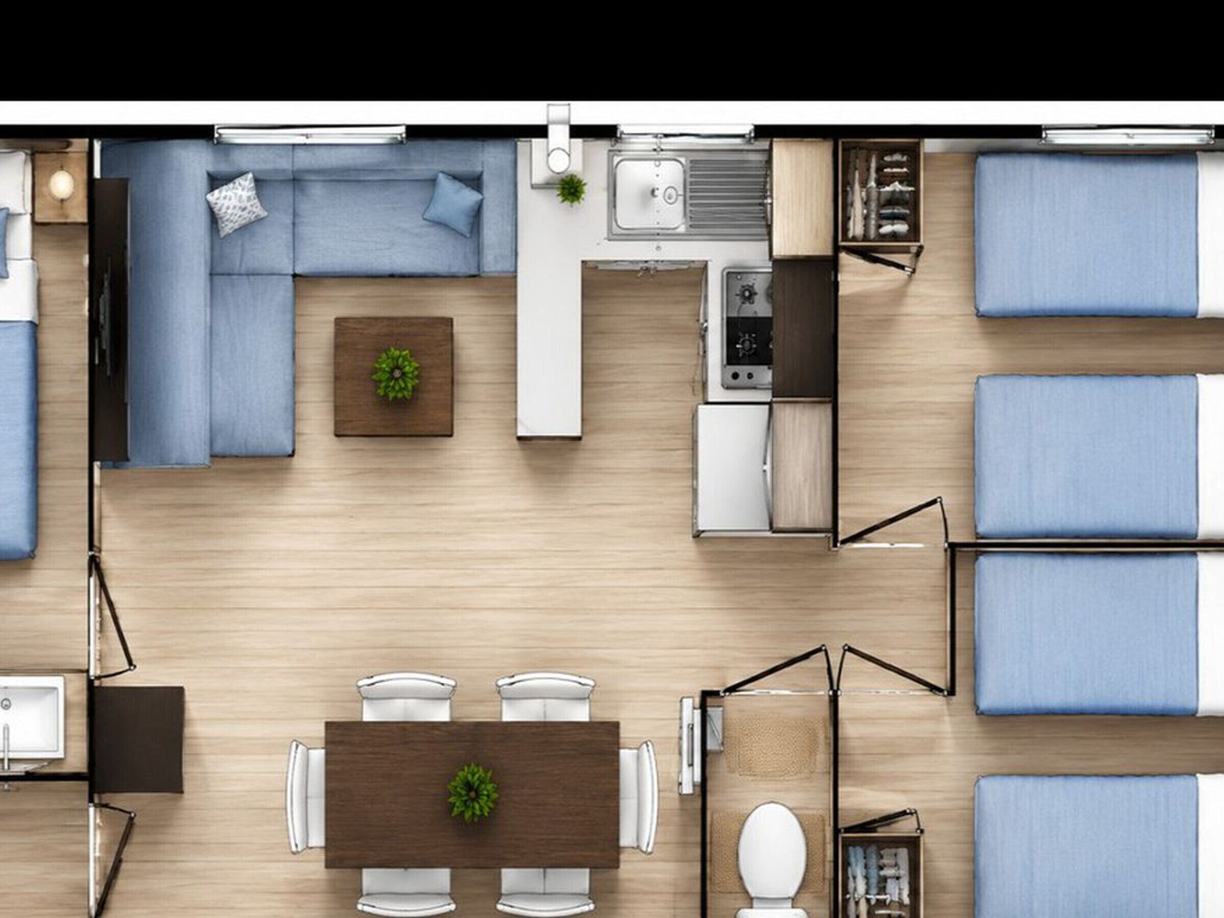 Ett kompakt bostadsutrymme med en soffa, ett matbord, ett litet kök och ett litet badrum.