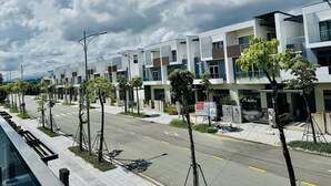 A modern residential building with multiple floors, balconies, and a clear sky. - Dreamy homestay Hue (Hue)
