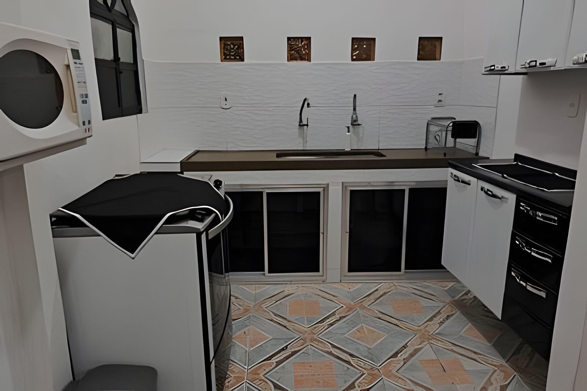 A compact kitchen with a microwave, sink, and stove.