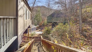 A wooden staircase leading to a house with a porch, surrounded by trees and a clear sky. - 1/4 Mi to Golf & Skiing! Sugar Mountain Getaway (Banner Elk)