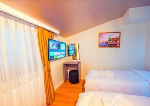 Quarto triplo standard, vista para a cidade