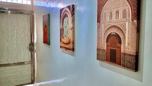 A hallway with three framed architectural designs on the wall. - Bonne étoile Imsouane : ground floor Apartment (Imsouane,)