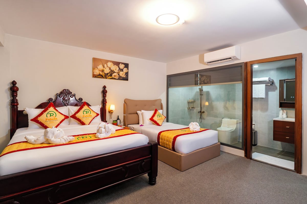 Superior Triple Room | Minibar, desk, laptop workspace, blackout drapes