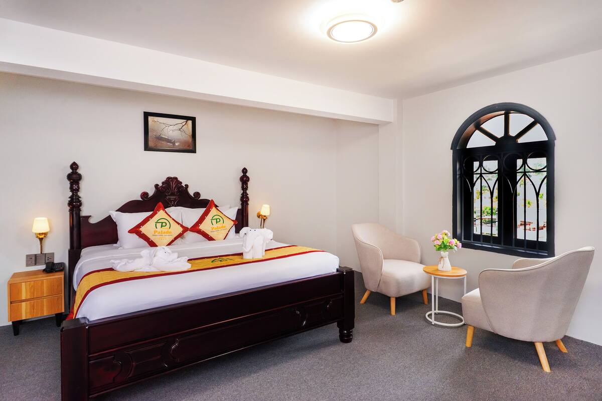 Deluxe Room, City View | Minibar, desk, laptop workspace, blackout drapes