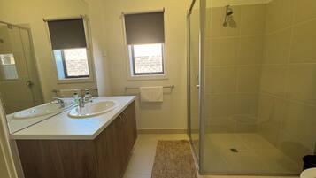 Shower, towels, soap, toilet paper