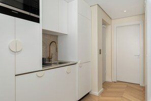 Fridge, microwave, oven, stovetop - Dolce Vita | Modern Sea Point Apartment (Cape Town)