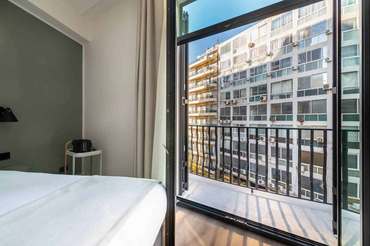 Queen Room with Balcony | Desk, laptop workspace, blackout drapes, WiFi (free)
