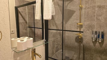 Shower, hair dryer, slippers, towels