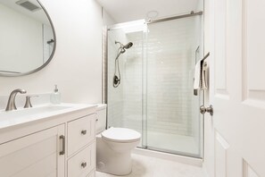 Shower, hair dryer, towels, soap