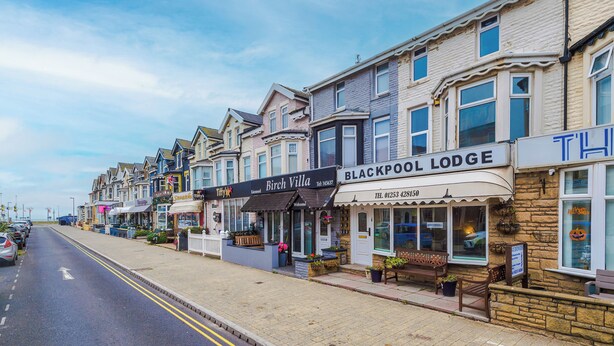 A row of seaside hotels with distinct architectural styles, including a prominent Blackpool Lodge. - Double Room 2nd Floor Room 5 (Blackpool)