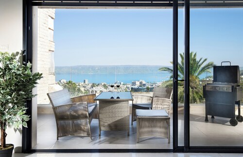 A spectacular villa with 12 bedrooms in 6 separate units, a spacious living room, a fully equipped kitchen, a barbecue area and a heated pool. The villa also features a luxurious rooftop jacuzzi, a football table, ping pong,