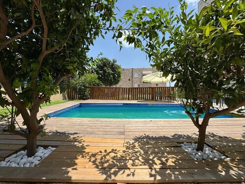 A spectacular villa with 12 bedrooms in 6 separate units, a spacious living room, a fully equipped kitchen, a barbecue area and a heated pool. The villa also features a luxurious rooftop jacuzzi, a football table, ping pong,