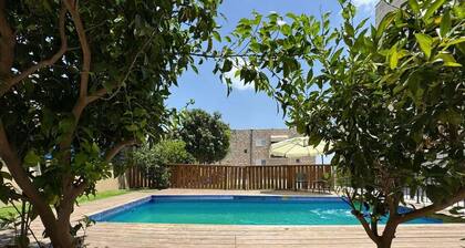 A spectacular villa with 12 bedrooms in 6 separate units, a spacious living room, a fully equipped kitchen, a barbecue area and a heated pool. The villa also features a luxurious rooftop jacuzzi, a football table, ping pong,