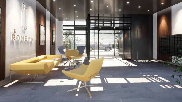 A modern lobby with a reception desk, seating area, and a glass entrance. - Romema *201* - Condo Luxe 1 bdr (Montreal)