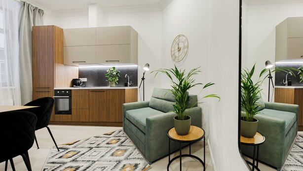 A modern apartment with a kitchen, a dining area, and a living room. - 1 bedroom apartment TWIN (Riga)