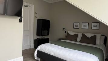 Double Room, City View | Blackout drapes, iron/ironing board, free WiFi