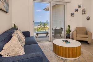 Villa, Sea View | Living area | 50-inch LED TV with cable channels