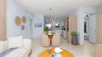 Villa, vistas al mar | Zona de estar | Televisión LED de 50 pulgadas con canales por cable