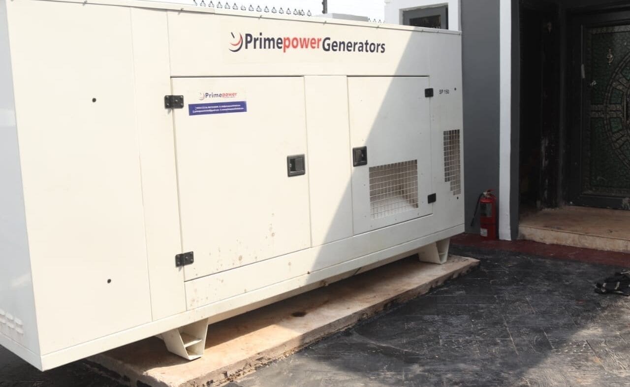 A large industrial generator unit labeled "Primepower Generators" with a fire extinguisher nearby.
