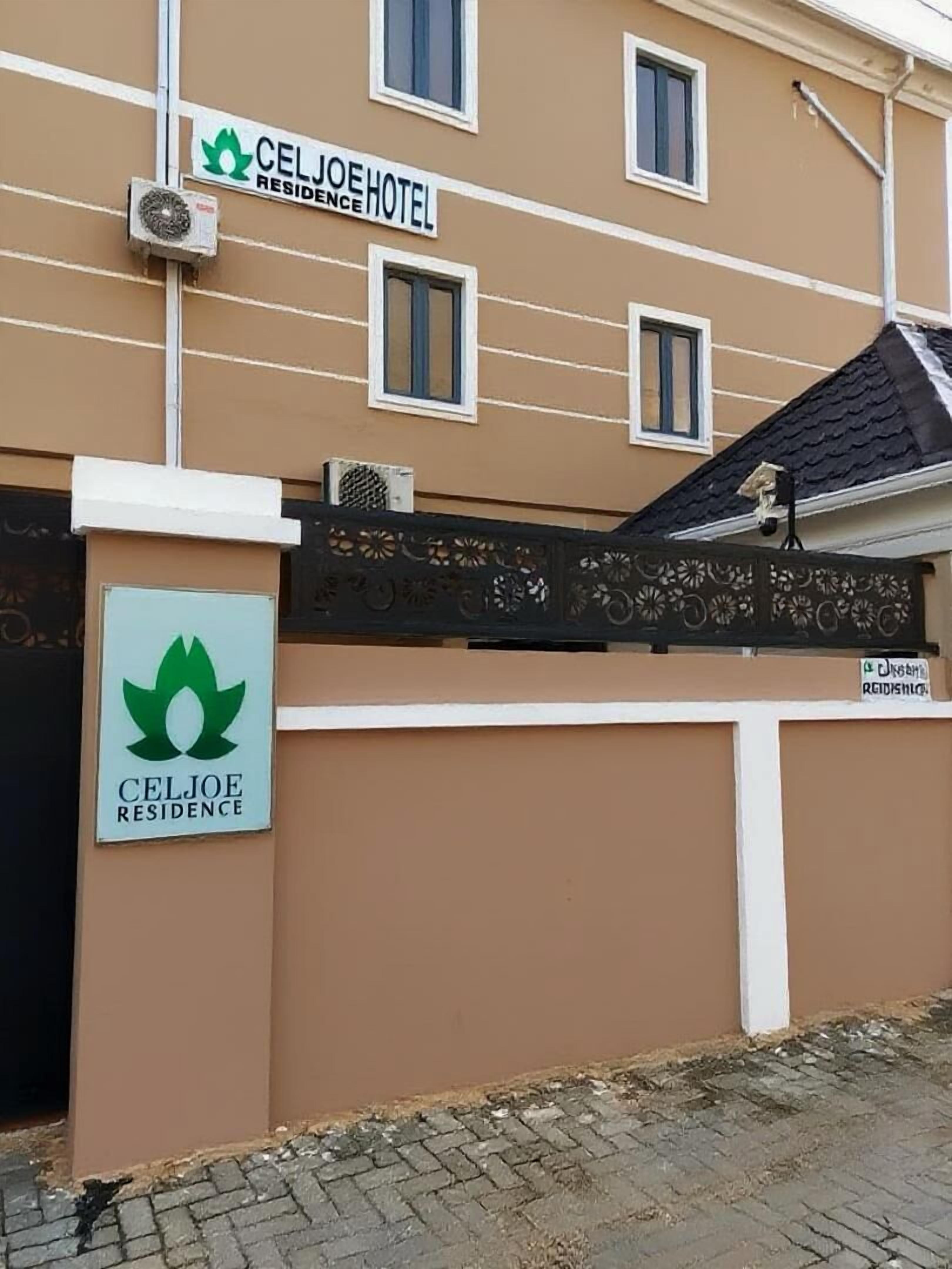 A hotel entrance with a sign reading "CELJOE HOTEL RESIDENCE".