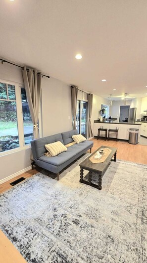 Living area - Master bedroom with en-suite bathroom, and a shared kitchen and living room (North Vancouver)
