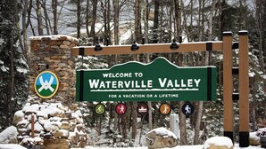 A welcome sign for Waterville Valley with symbols indicating activities like hiking, biking, and skiing. - Waterville Estate chalet perfect for relaxing stays Access to Pool, Hot Tub, Gym (Campton)