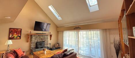 Smart TV, fireplace, table football, books