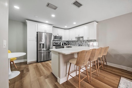 Fridge, microwave, oven, stovetop. Modern Pet-Friendly 2BR Condo