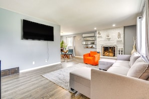 TV, fireplace, table football - Spacious Retreat, Pet Friendly Yard & Game Space (Columbus)