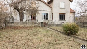 A two-story house with a stone facade, a small porch with chairs, and a tree in the front yard. - Chez Marius - ESTENOS (ESTENOS)