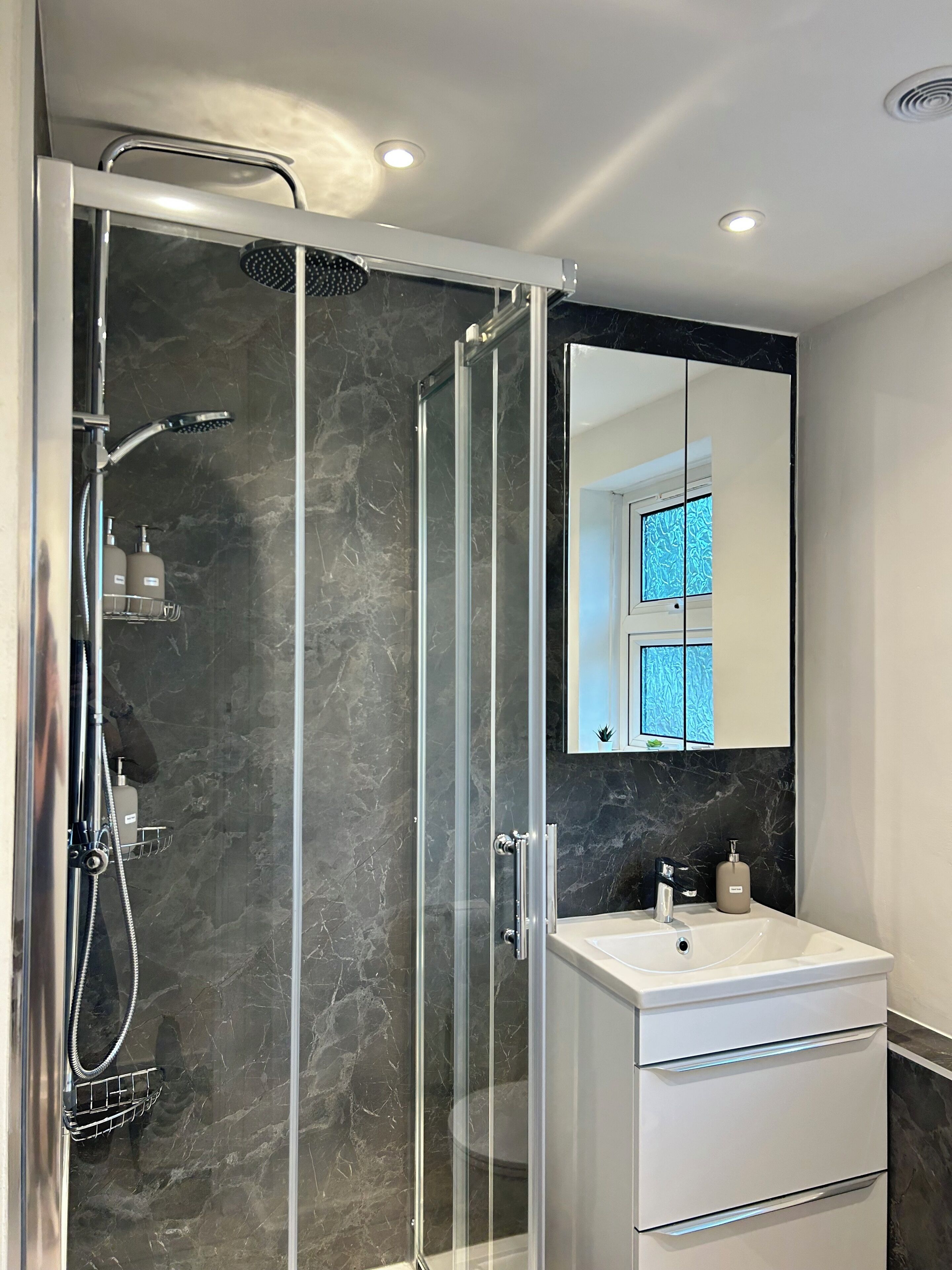 Shower, towels, soap, toilet paper