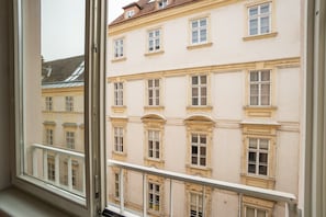 A multi-story building with classical architecture, featuring symmetrical windows and decorative moldings. - Modern studio next to Stephansdom (Wien)