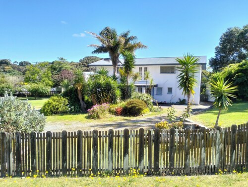Family bach on large section. Close walk to shops and estuary.