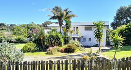 Family bach on large section. Close walk to shops and estuary.