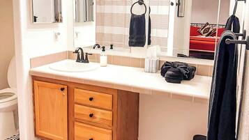 Shower, hair dryer, towels, soap