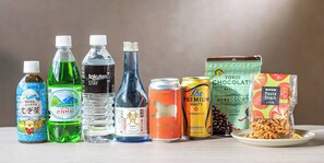 A variety of beverages and snacks on a table.